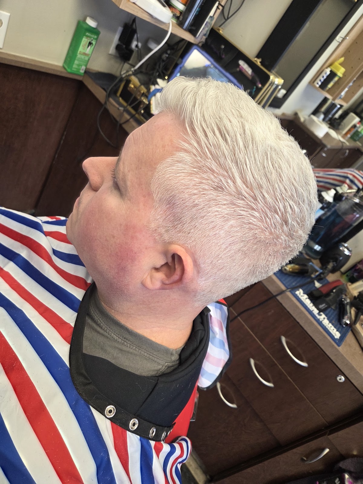 Senior gentleman with a precise haircut at Mike's Barber Shop