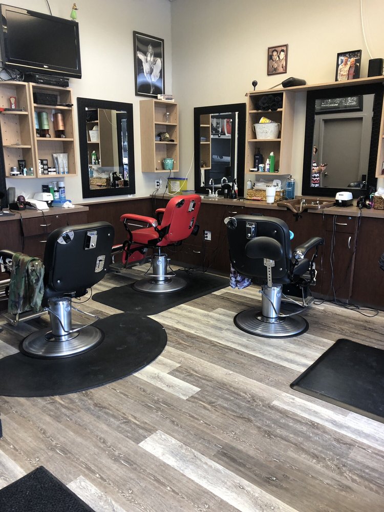 Three barber chairs at Mike's Barber Shop showing the clean, classic interior